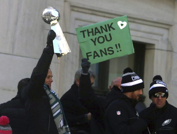 Philadelphia Eagles NFL football team president Don Smolenski holds the Lombardi Trophy as he rides in the Eagles team parade and celebration Thursday Feb. 8, 2018, in Philadelphia. The Eagles defeated the New England Patriots in Super Bowl 52. (AP Photo/Jacqueline Larma)