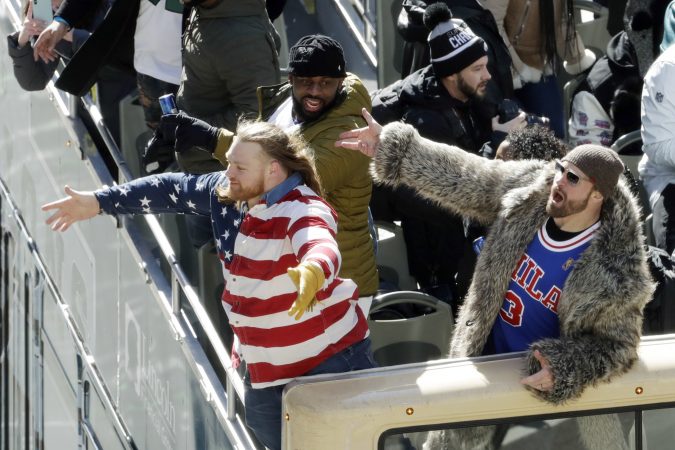 Philadelphia Eagles' Chris Long, from right, Fletcher Cox and Beau Allen celebrate during a Super Bowl victory parade, Thursday, Feb. 8, 2018, in Philadelphia. The Eagles beat the New England Patriots 41-33 in Super Bowl 52. (AP Photo/Matt Slocum)