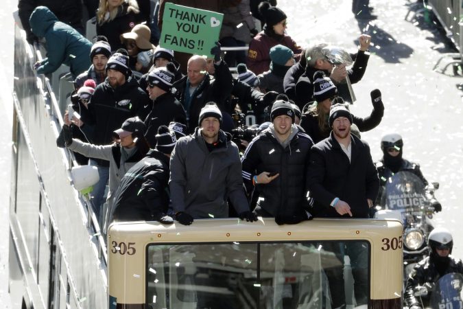 Philadelphia Eagles NFL football team quarterbacks Nick Foles, from left, Nate Sudfeld and Carson Wentz celebrate during a Super Bowl victory parade, Thursday, Feb. 8, 2018, in Philadelphia. The Eagles beat the New England Patriots 41-33 in Super Bowl 52. (AP Photo/Matt Slocum)