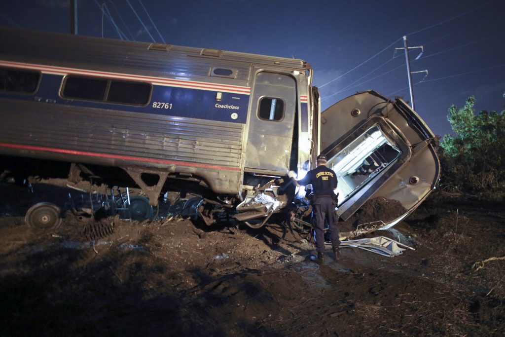 Pennsylvania-Year In Review In this May 12, 2015, file photo, emergency personnel work the scene of a deadly train wreck in Philadelphia. An Amtrak train headed to New York City derailed and crashed in Philadelphia. (AP Photo/ Joseph Kaczmarek, File)