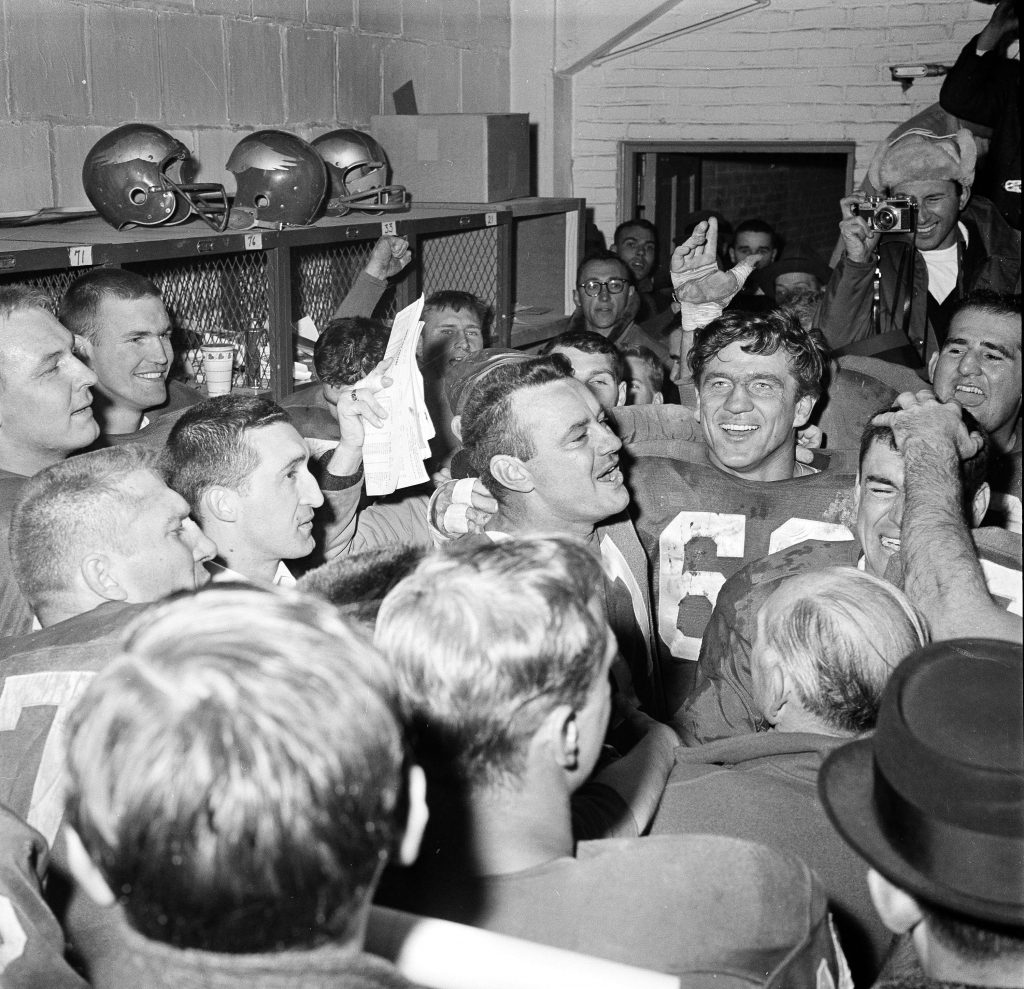 EAGLES PACKERS 1960 Norm Van Brocklin, left, who quarterbacked the Philadelphia Eagles to a 17-13 win over the Green Bay Packers in 1960, alternately laughs and cries in dressing room at Franklin Field. With him is Chuck Bednarik. (AP photo)