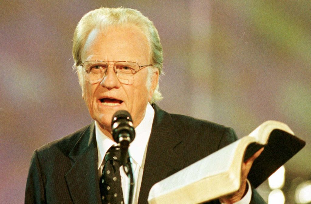 GRAHAM Rev. Billy Graham reads from the Bible during the third night of the Carolinas Billy Graham Crusade at Ericsson Stadium in Charlotte, N.C., Saturday, Sept. 28, 1996. The crusade runs through Sunday, Sept. 29.