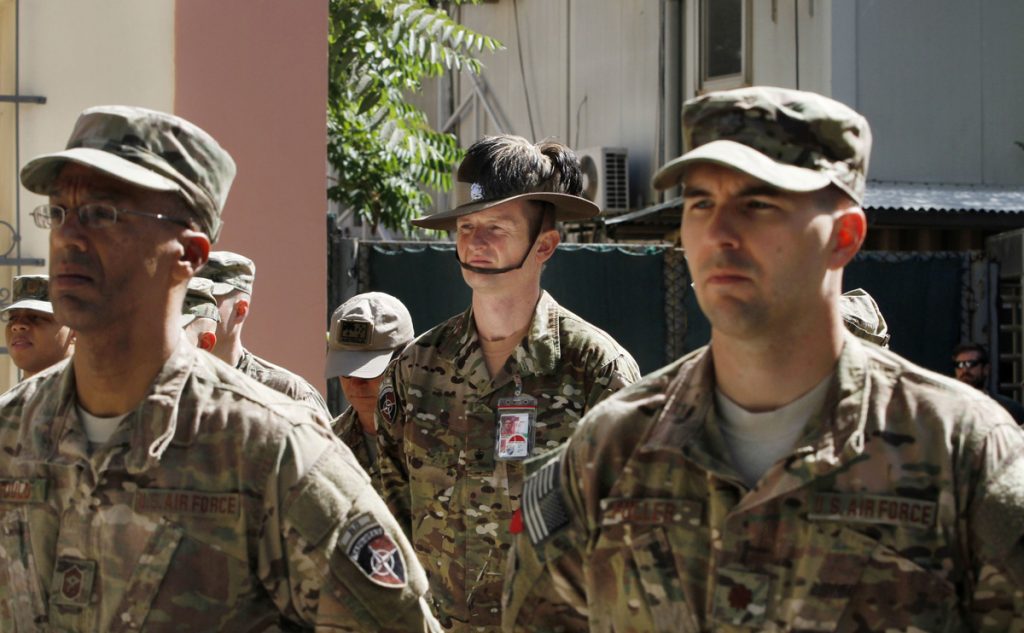 Afghanistan US soldiers stand attention during a ceremony marking Memorial Day at the Resolute Support main headquarters in Kabul, Afghanistan, Monday, May 25, 2015. (Allauddin Khan/AP Photo)