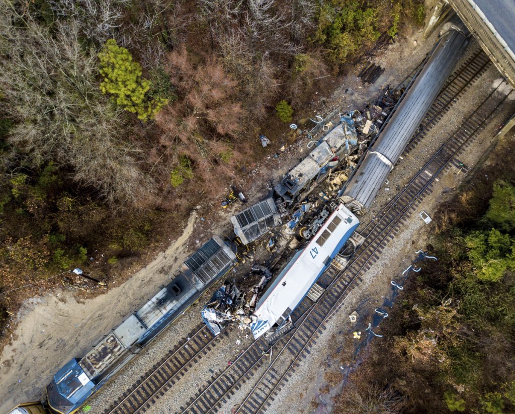 Train Crash South Carolina An aerial view of the site of an early morning train crash Sunday, Feb. 4, 2018 between an Amtrak train, bottom right, and a CSX freight train, top left, in Cayce, SC. The Amtrak passenger train slammed into a freight train in the early morning darkness Sunday, killing at least two Amtrak crew members and injuring more than 110 people, authorities said. (Jeff Blake/AP Photo)