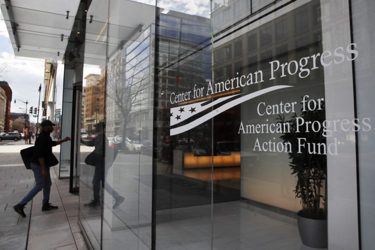 A man walks into the Center for American Progress, Wednesday, Feb. 21, 2018, at their office in Washington. The major liberal policy group is raising the ante on the health care debate with a new plan that builds on Medicare to guarantee coverage for all. Called “Medicare Extra for All,” the proposal to be released Feb. 22, 2018, by the Center for American Progress gives politically energized Democrats more options to achieve a long-sought goal. (Jacquelyn Martin/AP Photo)