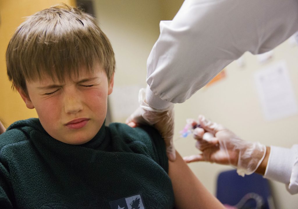 Reed Olson Reed Olson, 8, gets a flu shot, Monday, Feb. 5, 2018. The U.S. government's latest flu report released on Friday, Feb. 2, 2018, showed flu season continued to intensify the previous week, with high volumes of flu-related patient traffic in 42 states, up from 39 the week before. (David Goldman/AP Photo)