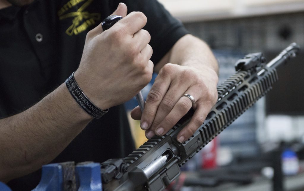 Gunning of America In this photo taken March 15, 2017, Karl Sorken, production manager for Battle Rifle Co., based in Webster, Texas, works on the rails of an AR-15style rifle. Battle Rifle is one of now more than 10,000 gunmakers in the United States. (Lisa Marie Pane/AP Photo)