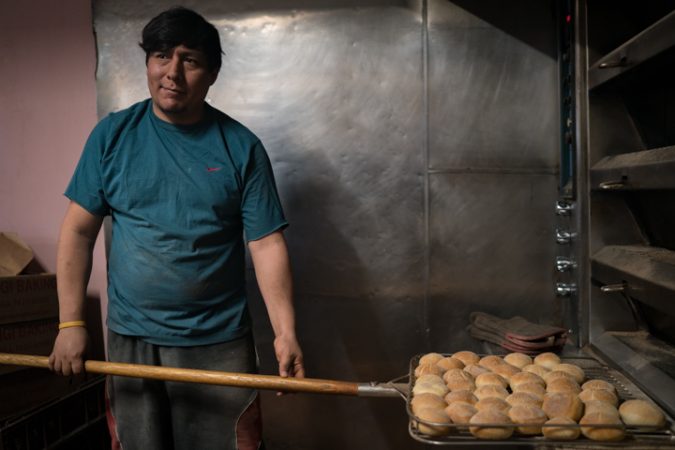 Carlos Garcia preps rolls at Carangi Baking Co. & Cafe in South Philadelphia in preparation for the Super Bowl on January 4, 2018.