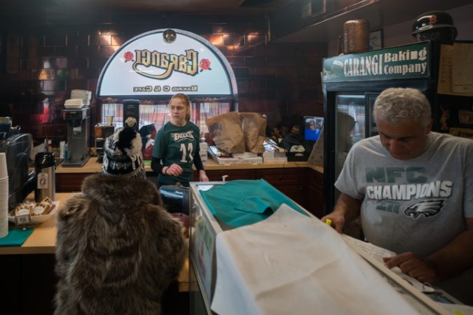 Darianna Troilo waits on customers at Carangi Baking Co. & Cafe in South Philadelphia in preparation for the Super Bowl on January 4, 2018.