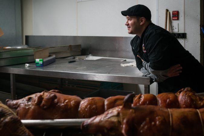 Jules Esposito takes a break from prepping for the Super Bowl at Esposito’s Porchetta in South Philadelphia on January 4, 2018. (Branden Eastwood for WHYY)