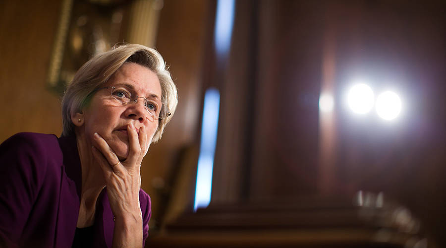 Massachusetts Sen. Elizabeth Warren, above, and Virginia Sen. Mark Warner are introducing legislation that would levy harsh penalties for security breaches at credit-rating agencies. (Drew Angerer/Getty Images)