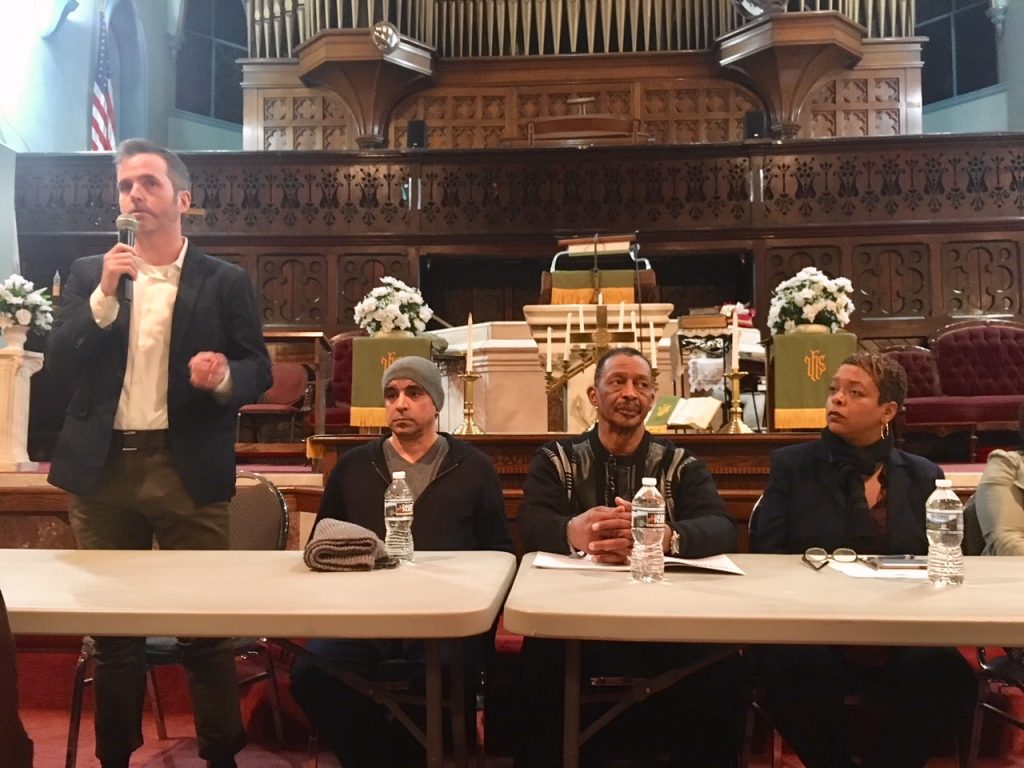 IMG_3931 Philadelphia Inquirer columnist Mike Newall, far left, speaks at a community meeting about the prospect of the city hosting a safe-injection site. Seated next to him, left to right, are Gilberto Gonzales, Louis Cain, and City Councilwoman Cindy Bass.
(Darryl Murphy/for WHYY)