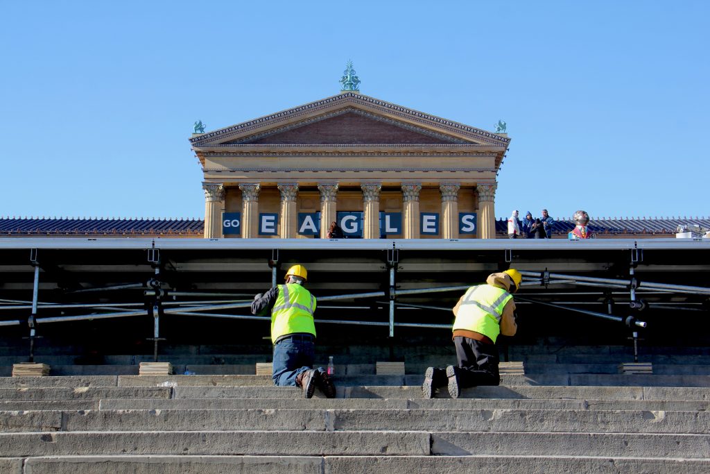 Image uploaded from iOS (19) Workmen set up a stage in front of the Art Museum in preparation for the Eagles parade.