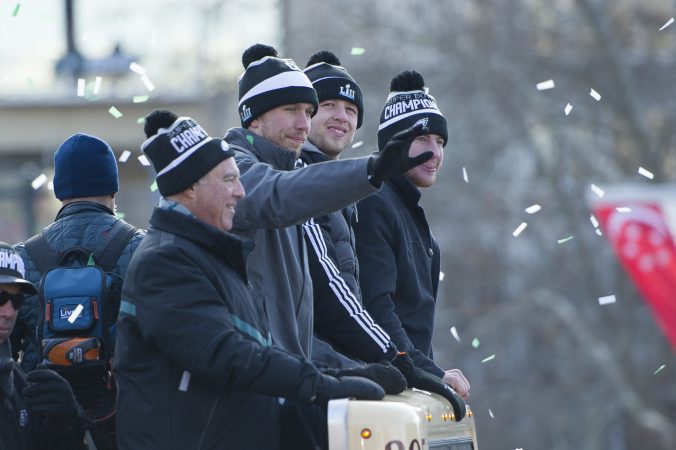 From left Eagles owner Jeff Lurie, quarterback, Nick Foles, backup quarterback Nate Sudfeld, and quarterback Carson Wentz. (Jonathan Wilson for WHYY)