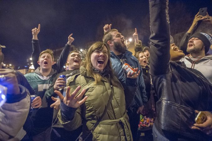 Fans cheer the Eagles at Broad and Kater Streets.