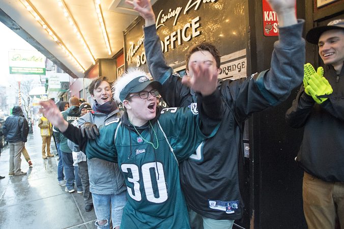 Seniors from Strath Haven High School in Seniors from Strath Haven High School in Wallingford sing Eagles Fight Song while waiting for the TLA's Tailgate Party to open its doors on South Street.