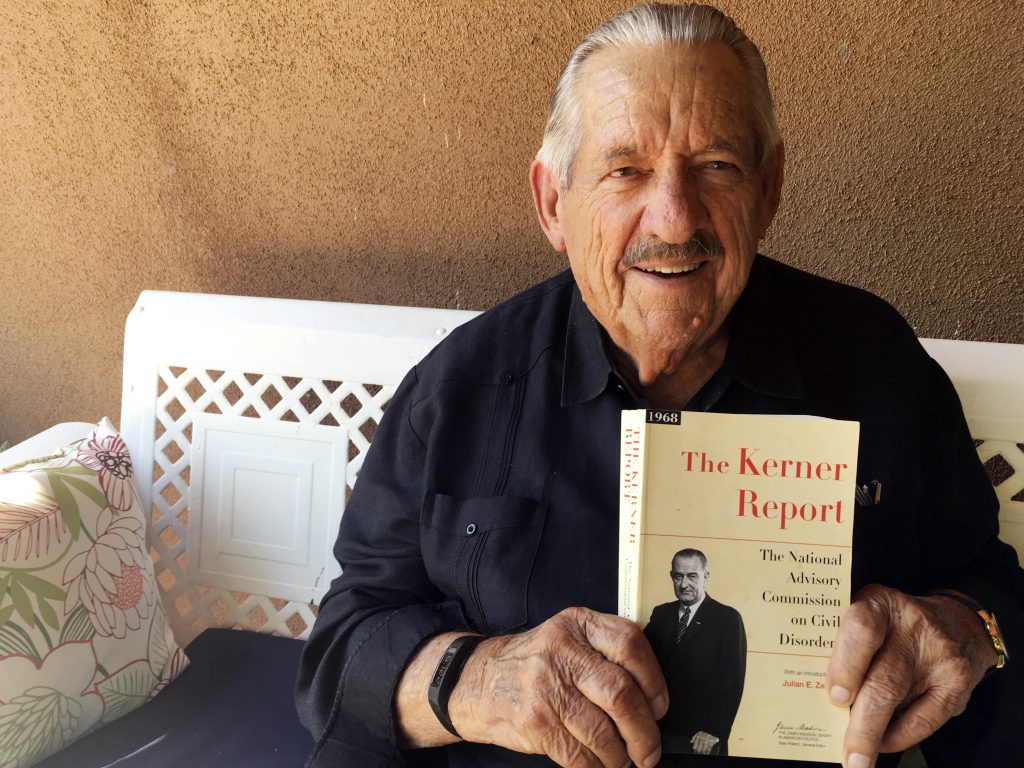 Former Democratic Sen. Fred Harris of Oklahoma, seen in August 2017, holds a copy of The Kerner Report, as he discusses its 50th anniversary. Harris is the last surviving member of the Kerner Commission. Former Democratic Sen. Fred Harris of Oklahoma, seen in August 2017, holds a copy of The Kerner Report, as he discusses its 50th anniversary. Harris is the last surviving member of the Kerner Commission.
(Russell Contreras/AP)