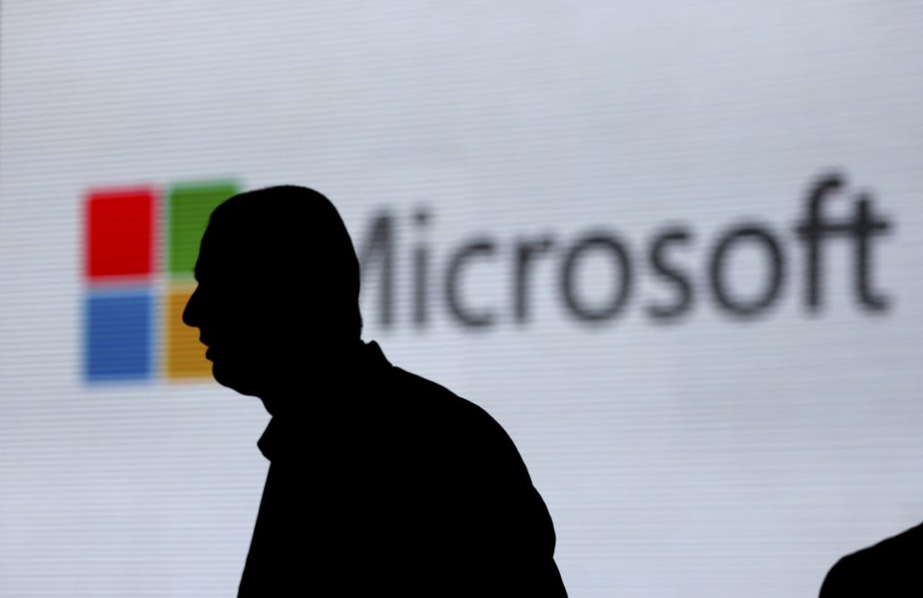 An unidentified man walks in front of the Microsoft logo at an event in New Delhi, India. Microsoft is at the center of a Supreme Court case on whether it has to turn over emails stored overseas. An unidentified man walks in front of the Microsoft logo at an event in New Delhi, India. Microsoft is at the center of a Supreme Court case on whether it has to turn over emails stored overseas. (Altaf Qadri/AP)