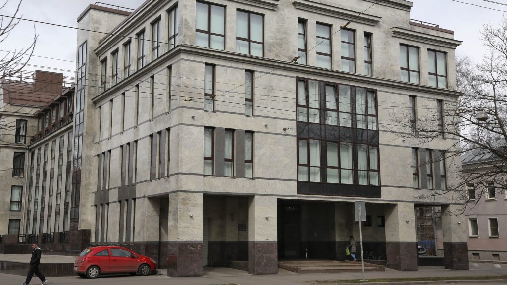 In this file photo taken on April 19, 2015, a women enters the four-story building known as the “troll factory” in St. Petersburg, Russia. The U.S. government alleges the Internet Research Agency started interfering as early as 2014 in U.S. politics, extending to the 2016 presidential election. In this file photo taken on April 19, 2015, a women enters the four-story building known as the