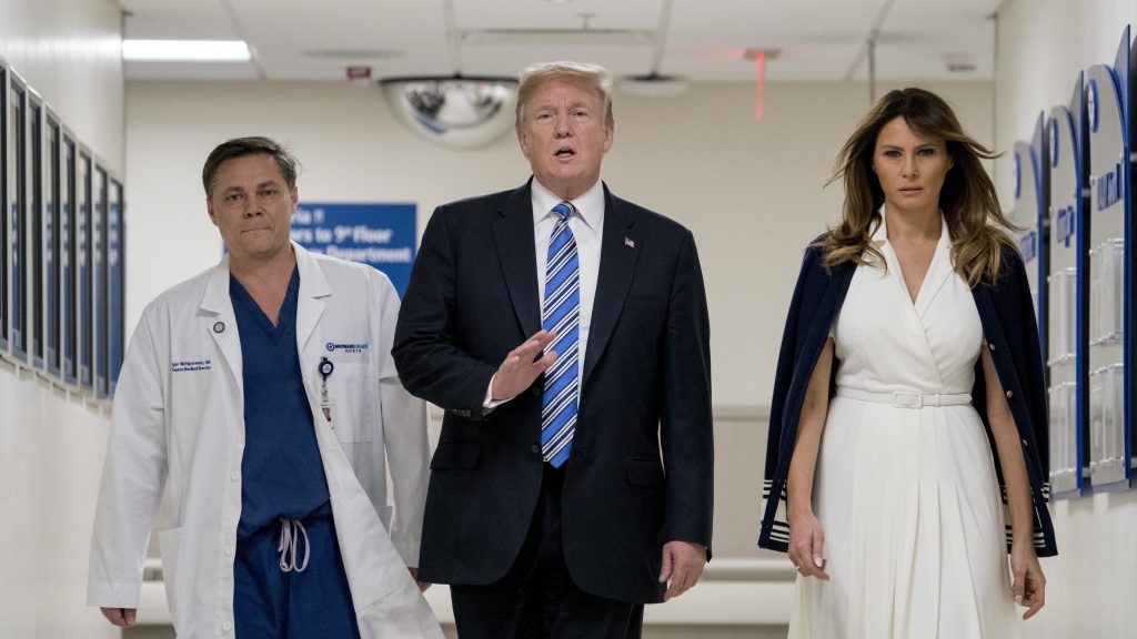 President Trump, accompanied by first lady Melania Trump, right, and Dr. Igor Nichiporenko, speaks to reporters while visiting medical staff at Broward Health North in Pompano Beach, Fla., on Friday. President Trump, accompanied by first lady Melania Trump, right, and Dr. Igor Nichiporenko, speaks to reporters while visiting medical staff at Broward Health North in Pompano Beach, Fla., on Friday.