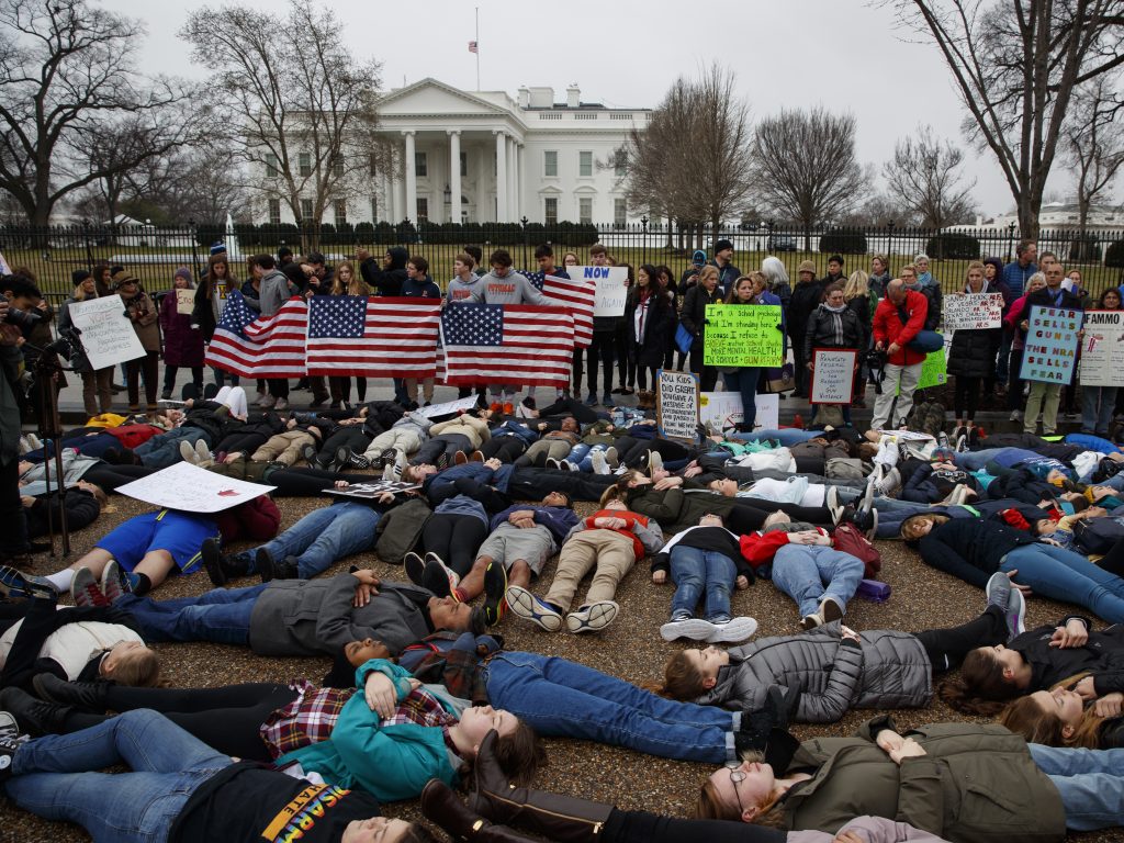 Demonstrators participate in a “lie-in” during a protest in favor of gun control reform in front of the White House. Grassroots groups are planning hundreds more protests in coming weeks. Demonstrators participate in a