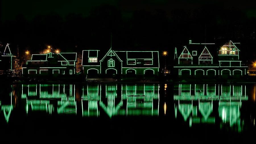 boathouse row phila parks and rec Houses on Boathouse row are lit up with green lights at night.