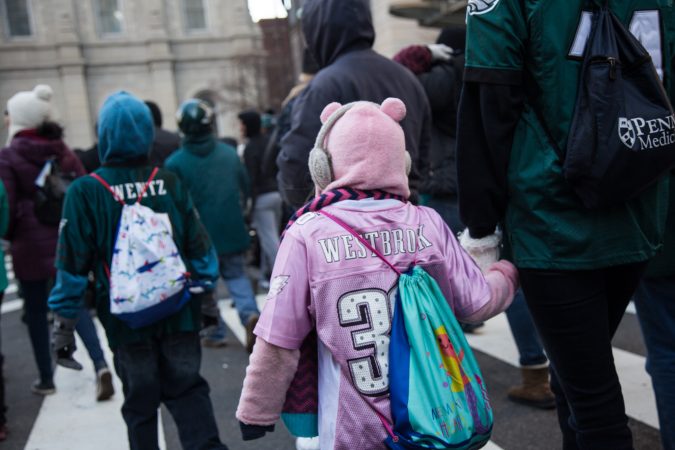 Over a million fans flocked to Center City and stood in the freezing temperatures to cheer on their winning Eagles for the Super Bowl Champions parade in Philadelphia February 8th 2018. (Emily Cohen for WHYY)