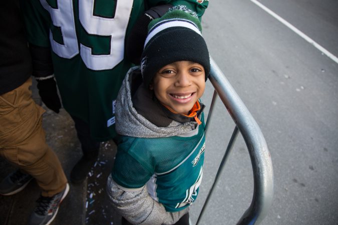 Ryan Smith,6, gets right up to the barricade to cheer on the winning Eagles for the Super Bowl Champions parade in Philadelphia February 8th 2018. (Emily Cohen for WHYY)