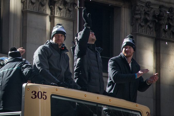 Eagles quartbacks Nick Foles and Carson Wentz smile and wave to their adoring fans at the Super Bowl Champions parade in Philadelphia February 8th 2018. (Emily Cohen for WHYY)