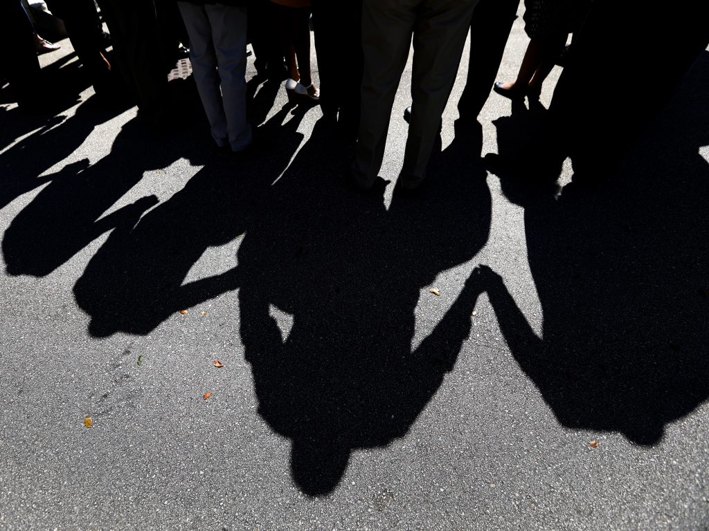 People gather for a memorial one day after the deadly shooting in Parkland, Fla. Experts warn that Russians are exploiting the tragedy on social media. People gather for a memorial one day after the deadly shooting in Parkland, Fla. Experts warn that Russians are exploiting the tragedy on social media. (Carolyn Cole/LA Times via Getty Images)