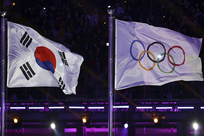 Pyeongchang Olympics Opening Ceremony The South Korea and Olympic flag are seen during the opening ceremony of the 2018 Winter Olympics in Pyeongchang, South Korea, Friday, Feb. 9, 2018. (AP Photo/Michael Sohn)