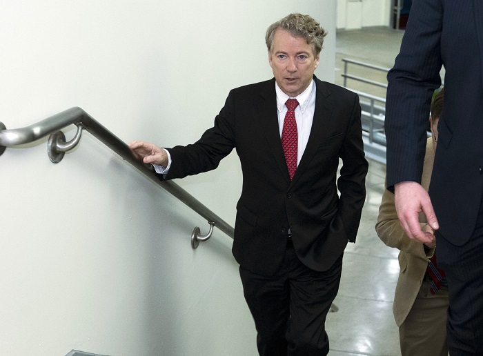 Sen. Rand Paul, R-Ky., walks to the Senate chamber, at the U.S. Capitol, Thursday, Feb. 8, 2018, in Washington.(AP Photo/Jose Luis Magana)