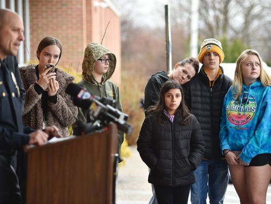 Central York District parent Linda Veras-Lopez, (center), leans her head on her 14-year-old son Tyler Shields' shoulder during a press conference outside the Springettsbury Township Police Department Thursday. Veras-Lopez said she plans to attend every press conference because she wants updates on the police investigation into threats made to the school district earlier this week. (Chris Dunn/York Daily Record)