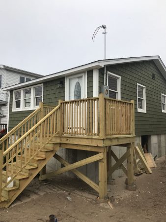 New York City houses in various stages of elevation. (Courtesy of New York City Mayor’s Office of Housing Recovery Operations)