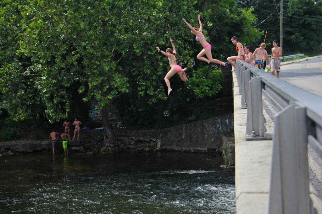 2017 07 20-e lee-musconetcong river asbury nj-teens swim Teenagers take turns jumping into the Musconetcong river just below the Asbury Mill Dam. (Emma Lee/WHYY)
