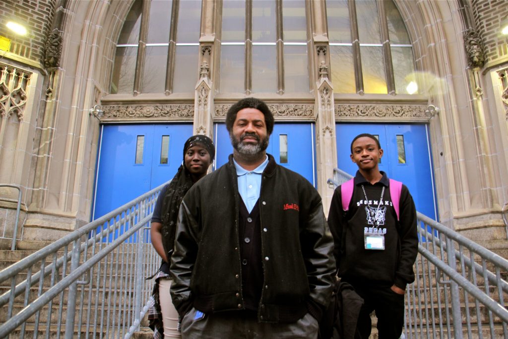 2018 03 01-e lee-sharif el mekki-philadelphia mastery shoemaker school-student activists Mastery Shoemaker Principal Sharif El-Mekki, 46. stamds at the entrance to the school with students Essi Gasonu (left) and Bryce Thompson. (Emma Lee/WHYY)