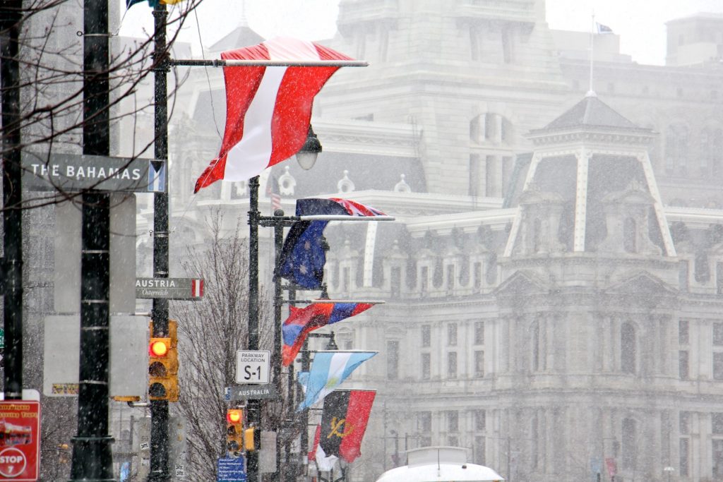 2018 03 02-e lee-philadelphia center city-noreaster The flags of many nations that line the Ben Franklin Parkway are battered by strong winds as snow falls in Center City.