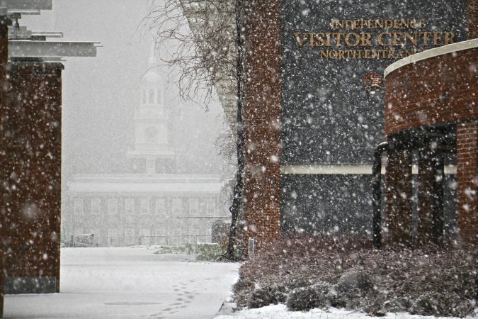 Independence Hall is nearly obscured by heavy snow fall. (Emma Lee/WHYY)