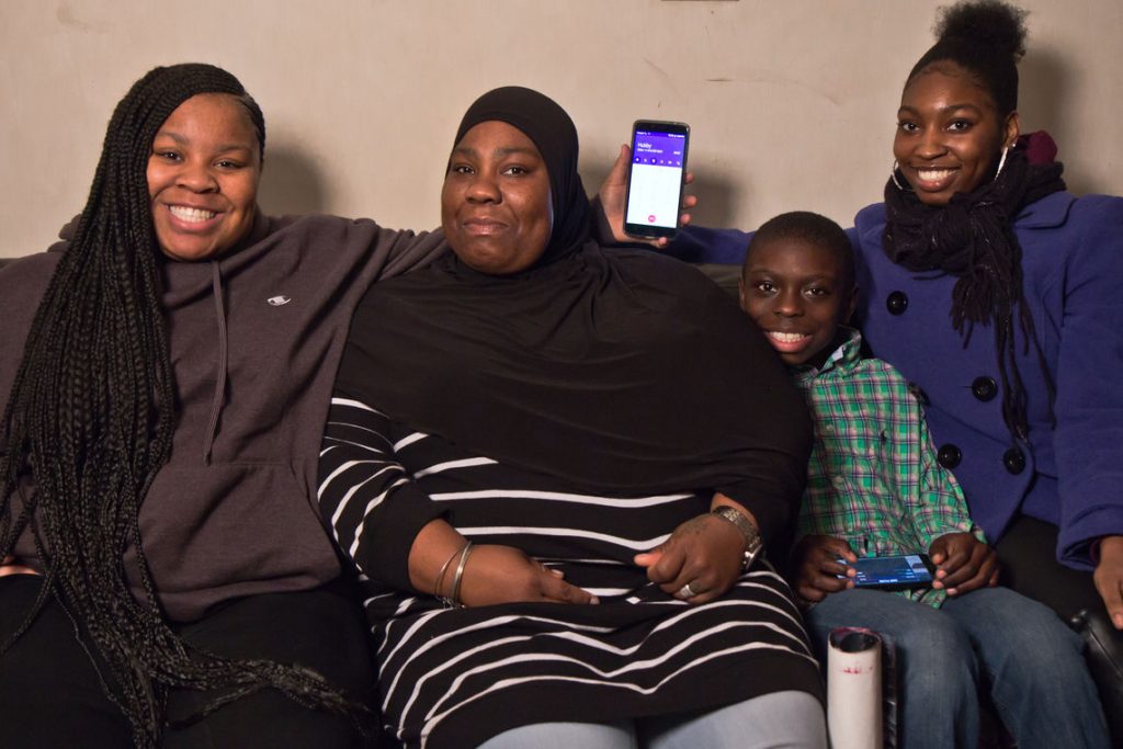 67347636073812918-nekia-and-family.full Nekia Pressley and three of her children take a break while on the phone with her husband, Demetris McDuffy, who is serving a life sentence he received as a juvenile. Pressley's daughter Yani (left) sits beside her mother, along with son Darwish and daughter Yasmeen (right).