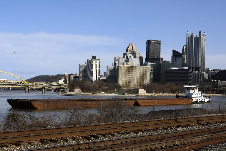 A towboat pushes barges on the Monongahela river past the skyline of downtown Pittsburgh, March 1, 2017. (AP Photo/Gene J. Puskar)