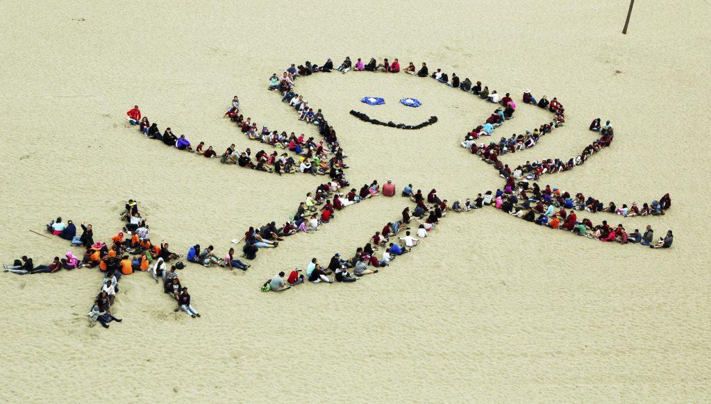 After cleaning up the beach, students create a smiling octopus and other ocean artwork during the 24th annual Kids Ocean Day beach cleanup at Dockweiler State Beach in Los Angeles Thursday, May 25, 2017. Some 4,000 children from Los Angeles-area elementary schools took part, the culmination of a year-round program by the Malibu Foundation for Environmental Education, which seeks to tell children how pollution affects the ocean. (Reed Saxon/AP Photo)
