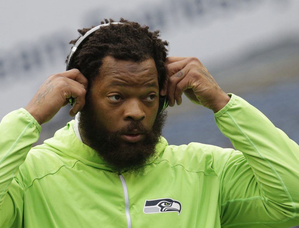 Michael Bennett Seattle Seahawks defensive end Michael Bennett wears headphones as he stands on the field during warmups before an NFL football game against the Houston Texans, Sunday, Oct. 29, 2017, in Seattle. (Elaine Thompson/AP Photo)