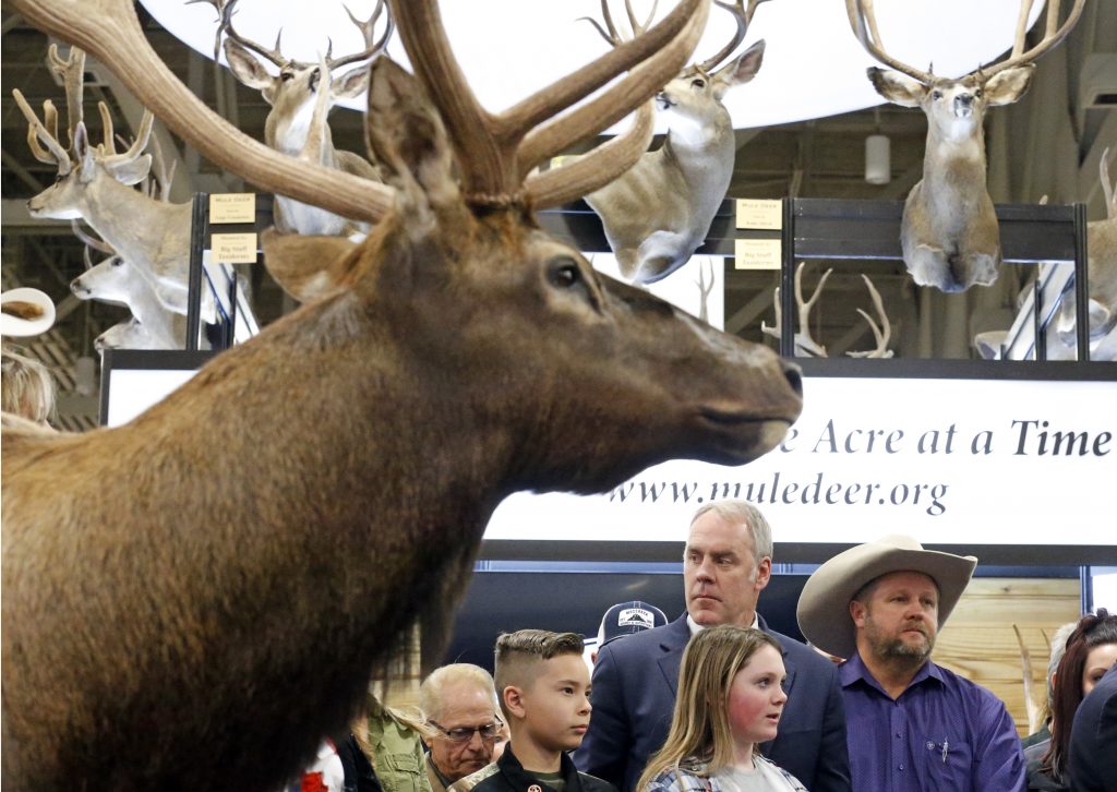 Ryan Zinke U.S. Interior Secretary Ryan Zinke looks on before speaking at the Western Conservation and Hunting Expo Friday, Feb. 9, 2018, in Salt Lake City. Zinke says he's taking steps to improve habitat and migration corridors in Western states for big-game animals such as elk, mule and deer.