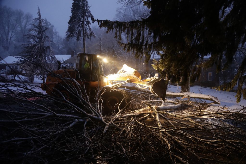 Coastal Storm Pennsylvania Streets department worker James Ockimey clears a downed tree during the storm Friday in Marple Township, Delaware County. The nor'easter pounded the Atlantic coast with hurricane-force winds and sideways rain and snow, flooding streets, grounding flights, stopping trains and leaving 1.6 million customers without power from North Carolina to Maine. Tens of thousands of homes in the Philadelphia region were still without power Sunday. (AP Photo/Matt Slocum)