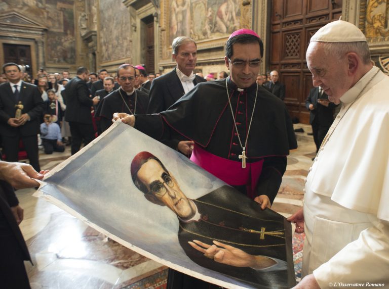 In 2015, Pope Francis is presented with an image of Roman Catholic Archbishop Oscar Romero during a private audience granted to participants to the pilgrimage from El Salvador at the Vatican. Pope Francis has cleared the way for slain Salvadoran Archbishop Oscar Romero to be made a saint, declaring that a churchman who stood up for the poorest of the poor in the face of right-wing oppression should be a model for Catholics today. (L'Osservatore Romano/Pool Photo via AP)