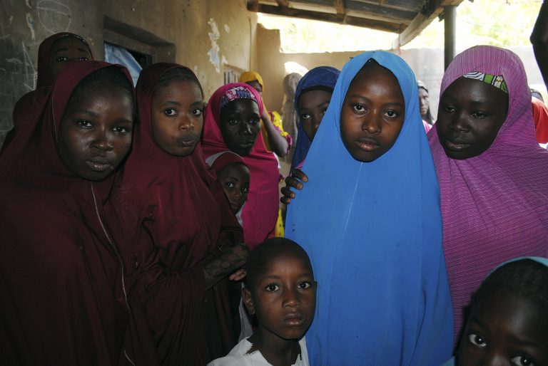 Aishat Alhaji, second, right, one of the kidnapped girls from the Government Girls Science and Technical College Dapchi who was freed, is photographed after her release, in Dapchi, Nigeria, Wednesday March. 21, 2018. Witnesses say Boko Haram militants have returned an unknown number of the 110 girls who were abducted from their Nigeria school a month ago. (Jossy Ola/AP Photo)