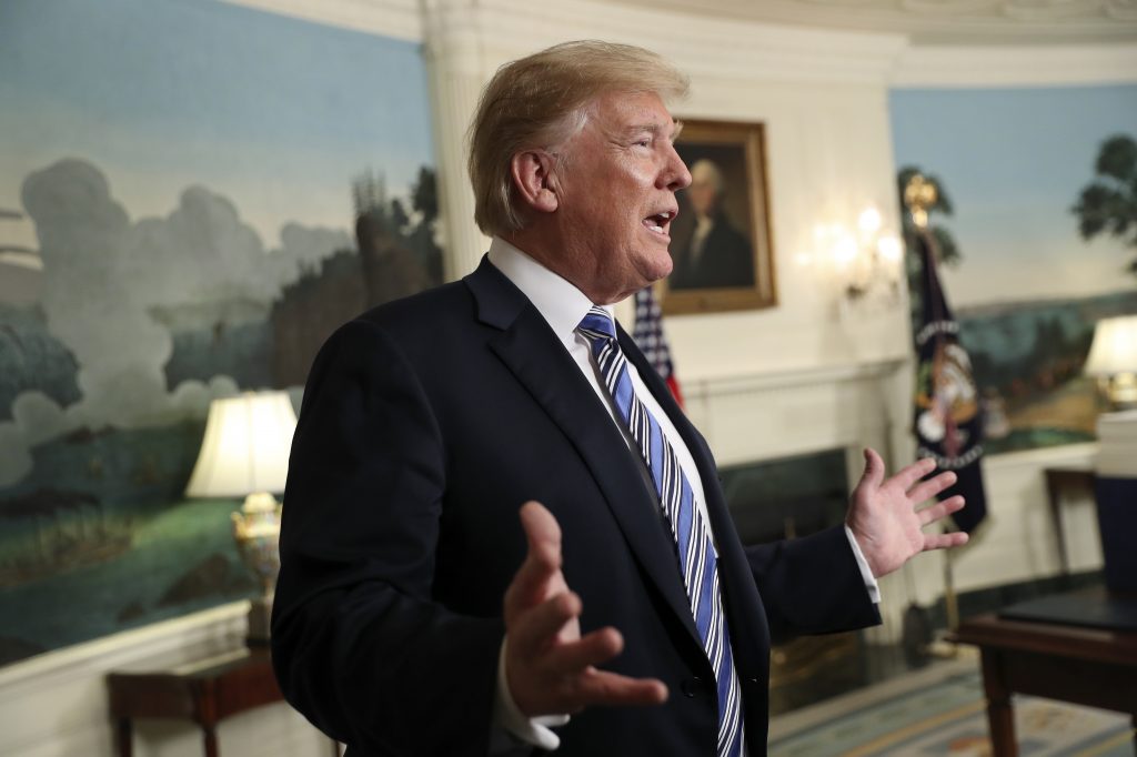 President Donald Trump answers questions as he leaves the Diplomatic Room of the White House in Washington, Friday, March 23, 2018, after speaking about the $1.3 trillion spending bill. (Pablo Martinez Monsivais/AP Photo)