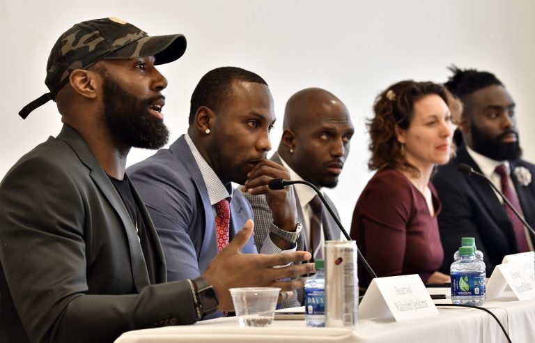 Philadelphia Eagles' Malcolm Jenkins, (left), speaks, as former NFL player Anquan Boldin, New England Patriots' Devin McCourty, moderator New York Times Magazine's Emily Bazelon, and New Orleans Saints' Demario Davis listen during a session to discuss criminal justice issues with other current and former NFL football players at Harvard Law School, Friday, March 23, 2018, in Cambridge, Mass. (Josh Reynolds/AP Photo)