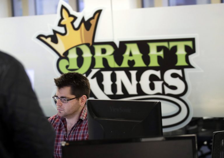 In this Thursday, Jan. 11, 2018, file photo, employees work at the DraftKings office in Boston. The explosion in popularity of daily fantasy sports over the last decade has created a generation of sports fans more attuned to gauging individual player statistics than how two teams may fare against each other, the challenge at the heart of traditional sports wagering. (Charles Krupa/AP Photo, file)