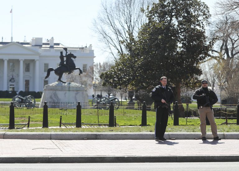Law enforcement officers at Lafayette Park across from the White House in Washington, take up positions as they close the area to pedestrian traffic, Saturday, March 3, 2018.    The Secret Service says a man shot himself outside the White House, and medical personnel are on the scene. President Donald Trump is not at the White House,  he's in Florida, but is set to return later Saturday. The agency says in a Twitter post that there are no other reported injuries related to the incident.   (Pablo Martinez Monsivais/AP Photo)